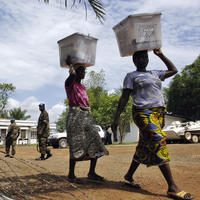 Citizens and UNMIL destroy voting materials in Liberia.